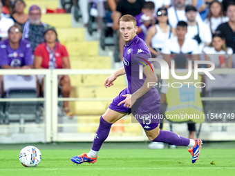 Pietro Comuzzo of ACF Fiorentina in action during the Serie A Enilive match between ACF Fiorentina and AC Monza at Stadio Artemio Franchi on...