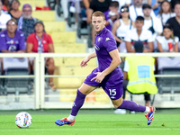 Pietro Comuzzo of ACF Fiorentina in action during the Serie A Enilive match between ACF Fiorentina and AC Monza at Stadio Artemio Franchi on...