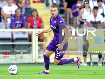 Pietro Comuzzo of ACF Fiorentina in action during the Serie A Enilive match between ACF Fiorentina and AC Monza at Stadio Artemio Franchi on...