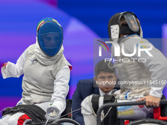 Beatrice Maria ''Bebe'' Vio Grandis of Italy competes against Nadiia Doloh of Ukraine during the Women's Foil Category B Quarterfinal at Gra...