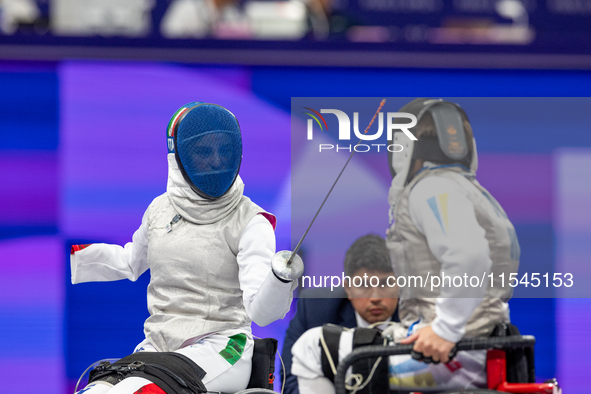 Beatrice Maria ''Bebe'' Vio Grandis of Italy competes against Nadiia Doloh of Ukraine during the Women's Foil Category B Quarterfinal at Gra...