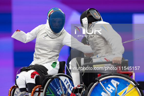 Beatrice Maria ''Bebe'' Vio Grandis of Italy competes against Nadiia Doloh of Ukraine during the Women's Foil Category B Quarterfinal at Gra...