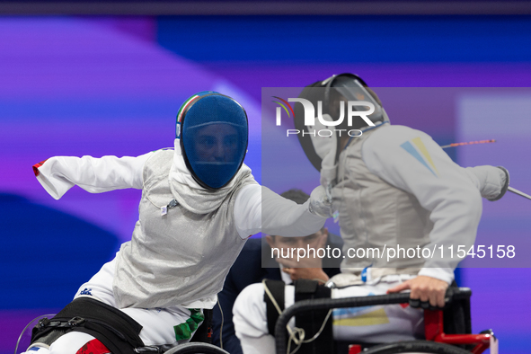 Beatrice Maria ''Bebe'' Vio Grandis of Italy competes against Nadiia Doloh of Ukraine during the Women's Foil Category B Quarterfinal at Gra...