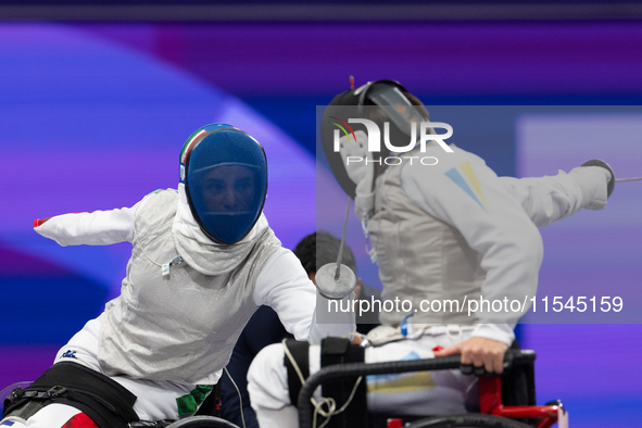 Beatrice Maria ''Bebe'' Vio Grandis of Italy competes against Nadiia Doloh of Ukraine during the Women's Foil Category B Quarterfinal at Gra...