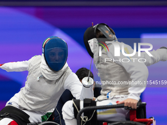 Beatrice Maria ''Bebe'' Vio Grandis of Italy competes against Nadiia Doloh of Ukraine during the Women's Foil Category B Quarterfinal at Gra...