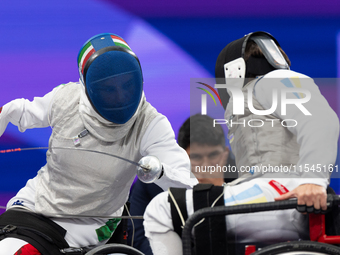 Beatrice Maria ''Bebe'' Vio Grandis of Italy competes against Nadiia Doloh of Ukraine during the Women's Foil Category B Quarterfinal at Gra...