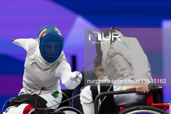 Beatrice Maria ''Bebe'' Vio Grandis of Italy competes against Nadiia Doloh of Ukraine during the Women's Foil Category B Quarterfinal at Gra...