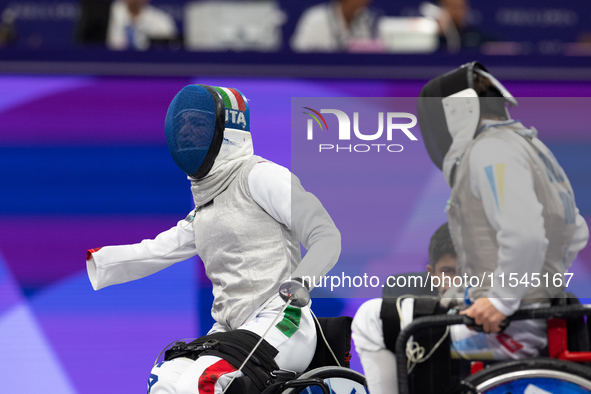 Beatrice Maria ''Bebe'' Vio Grandis of Italy competes against Nadiia Doloh of Ukraine during the Women's Foil Category B Quarterfinal at Gra...