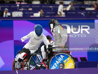 Beatrice Maria ''Bebe'' Vio Grandis of Italy competes against Nadiia Doloh of Ukraine during the Women's Foil Category B Quarterfinal at Gra...