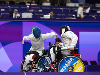 Beatrice Maria ''Bebe'' Vio Grandis of Italy competes against Nadiia Doloh of Ukraine during the Women's Foil Category B Quarterfinal at Gra...