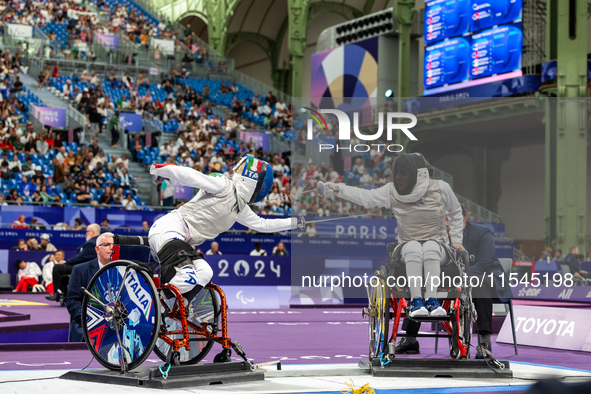 Beatrice Maria ''Bebe'' Vio Grandis of Italy competes against Nadiia Doloh of Ukraine during the Women's Foil Category B Quarterfinal at Gra...