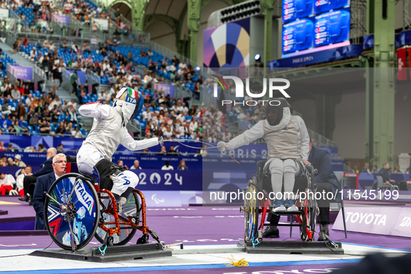 Beatrice Maria ''Bebe'' Vio Grandis of Italy competes against Nadiia Doloh of Ukraine during the Women's Foil Category B Quarterfinal at Gra...