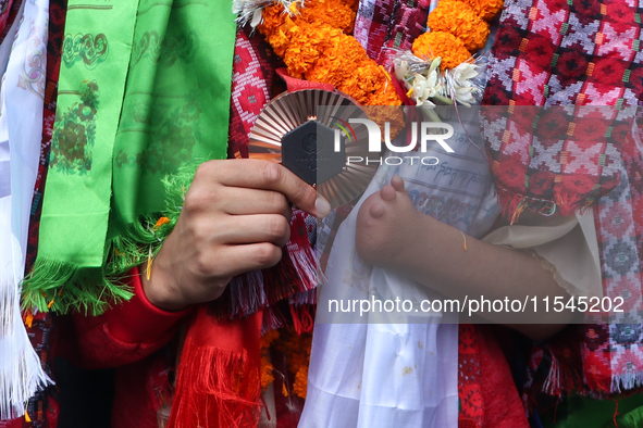 Nepali para athlete and first bronze medalist in Paralympics in Nepal's history, Palesha Goverdhan, poses for a photo along with her medal a...