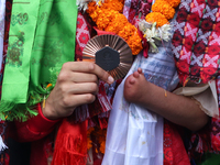 Nepali para athlete and first bronze medalist in Paralympics in Nepal's history, Palesha Goverdhan, poses for a photo along with her medal a...