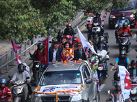 Nepali para athlete and first bronze medalist in Paralympics in Nepal's history, Palesha Goverdhan (center), is toured around the city in a...