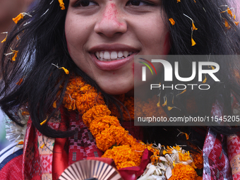 Nepali para athlete and first bronze medalist in Paralympics in Nepal's history, Palesha Goverdhan, poses for a photo along with her medal a...