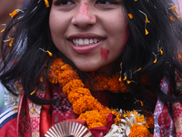 Nepali para athlete and first bronze medalist in Paralympics in Nepal's history, Palesha Goverdhan, poses for a photo along with her medal a...