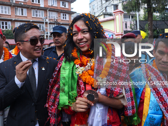 Nepali para athlete and first bronze medalist in Paralympics in Nepal's history, Palesha Goverdhan (center), is pictured during a public fel...