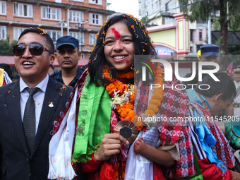 Nepali para athlete and first bronze medalist in Paralympics in Nepal's history, Palesha Goverdhan (center), is pictured during a public fel...