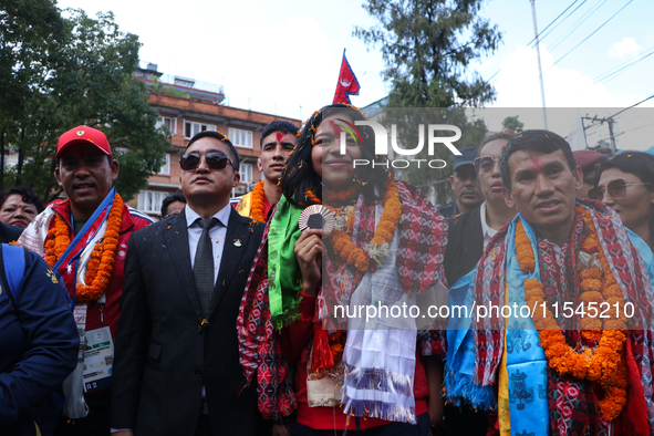 Nepali para athlete and first bronze medalist in Paralympics in Nepal's history, Palesha Goverdhan (center), is pictured during a public fel...