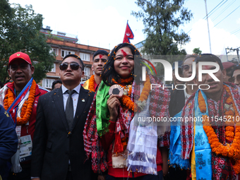 Nepali para athlete and first bronze medalist in Paralympics in Nepal's history, Palesha Goverdhan (center), is pictured during a public fel...