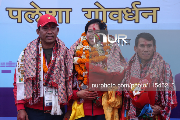 Nepali para athlete and first bronze medalist in Paralympics in Nepal's history, Palesha Goverdhan (center), is pictured during a public fel...