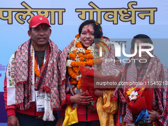 Nepali para athlete and first bronze medalist in Paralympics in Nepal's history, Palesha Goverdhan (center), is pictured during a public fel...