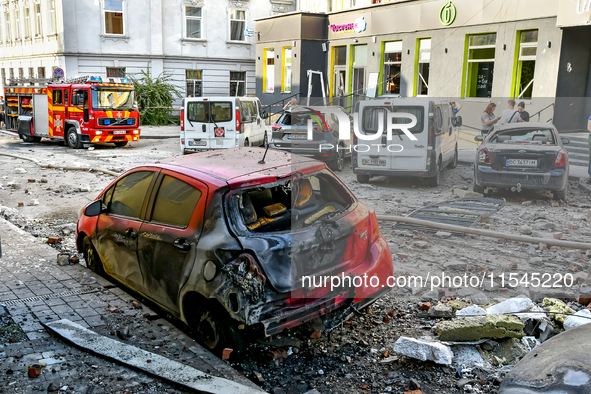 A fire-stricken car is in the street in the Zaliznychnyi district after the Russian missile attack in Lviv, Ukraine, on September 4, 2024. I...