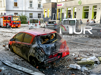 A fire-stricken car is in the street in the Zaliznychnyi district after the Russian missile attack in Lviv, Ukraine, on September 4, 2024. I...