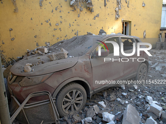 A car crushed by rubble is in the Zaliznychnyi district after the Russian missile attack in Lviv, Ukraine, on September 4, 2024. In the earl...