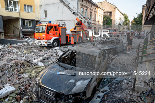 Destroyed cars are in the street in the Zaliznychnyi district after the Russian missile attack in Lviv, Ukraine, on September 4, 2024. In th...