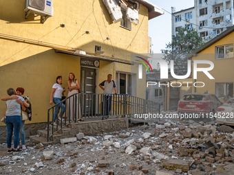 People stay outside a hotel in the Zaliznychnyi district after the Russian missile attack in Lviv, Ukraine, on September 4, 2024. In the ear...