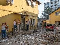 People stay outside a hotel in the Zaliznychnyi district after the Russian missile attack in Lviv, Ukraine, on September 4, 2024. In the ear...