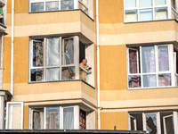 A man stands in the window broken by the shock wave from the Russian missile attack in the Zaliznychnyi district of Lviv, Ukraine, on Septem...