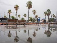 Tourists and locals walk through the city on a rainy September morning in Barcelona, Spain, on September 4, 2024. These first two weeks of S...