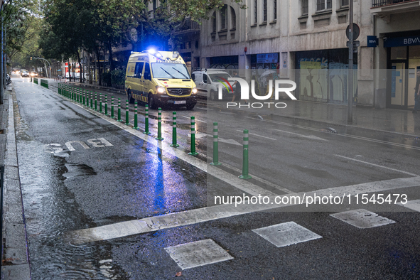 Tourists and locals walk through the city on a rainy September morning in Barcelona, Spain, on September 4, 2024. These first two weeks of S...