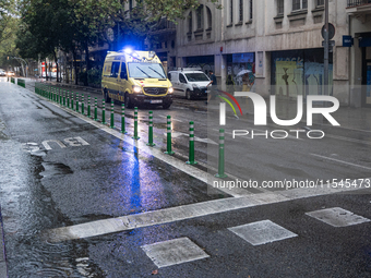 Tourists and locals walk through the city on a rainy September morning in Barcelona, Spain, on September 4, 2024. These first two weeks of S...