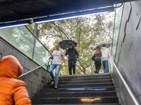 Tourists and locals walk through the city on a rainy September morning in Barcelona, Spain, on September 4, 2024. These first two weeks of S...