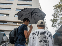 Tourists and locals walk through the city on a rainy September morning in Barcelona, Spain, on September 4, 2024. These first two weeks of S...