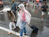 Tourists and locals walk through the city on a rainy September morning in Barcelona, Spain, on September 4, 2024. These first two weeks of S...