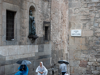 Tourists and locals walk through the city on a rainy September morning in Barcelona, Spain, on September 4, 2024. These first two weeks of S...