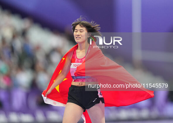 Yiting Shi of People's Republic of China celebrates winning gold in Women's 100m - T36 Final during the Paris 2024 Paralympic Games at Stade...