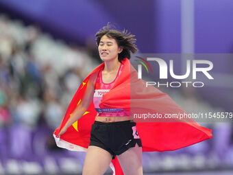 Yiting Shi of People's Republic of China celebrates winning gold in Women's 100m - T36 Final during the Paris 2024 Paralympic Games at Stade...