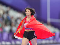 Yiting Shi of People's Republic of China celebrates winning gold in Women's 100m - T36 Final during the Paris 2024 Paralympic Games at Stade...