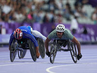 Adbulrahman Alqurashi of Saudi Arabia celebrates winning gold in Men's 100m - T53 Final during the Paris 2024 Paralympic Games at Stade de F...