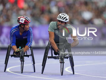 Adbulrahman Alqurashi of Saudi Arabia celebrates winning gold in Men's 100m - T53 Final during the Paris 2024 Paralympic Games at Stade de F...