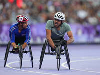 Adbulrahman Alqurashi of Saudi Arabia celebrates winning gold in Men's 100m - T53 Final during the Paris 2024 Paralympic Games at Stade de F...