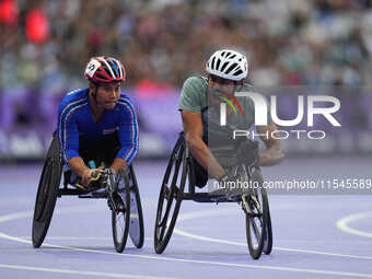 Adbulrahman Alqurashi of Saudi Arabia celebrates winning gold in Men's 100m - T53 Final during the Paris 2024 Paralympic Games at Stade de F...