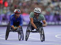 Adbulrahman Alqurashi of Saudi Arabia celebrates winning gold in Men's 100m - T53 Final during the Paris 2024 Paralympic Games at Stade de F...