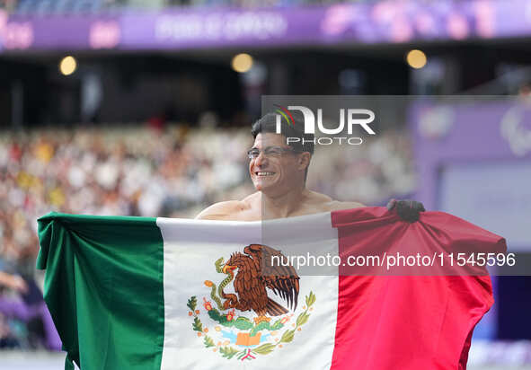 Juan Pablo Cervantes Garcia of Mexico celebrates winning gold in Men's 100m - T54 Final during the Paris 2024 Paralympic Games at Stade de F...